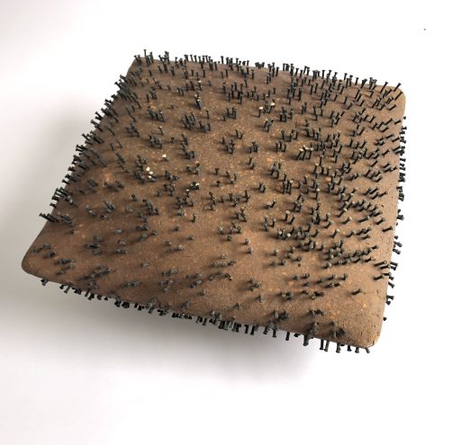 - a pillow for an unwelcome guest -  2023   Keramik, Nägel   15x35x35cm